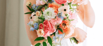 bride holding bright beautiful floral bouquet made in loudoun county, virginia