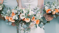 vibrant spring wedding floral bouquets orange white and purple budding flowers