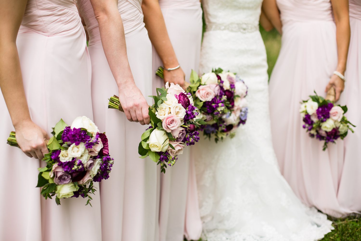 Blush pink dresses pop in contrast with deeper hued florals. Pamela Lepold Photography.