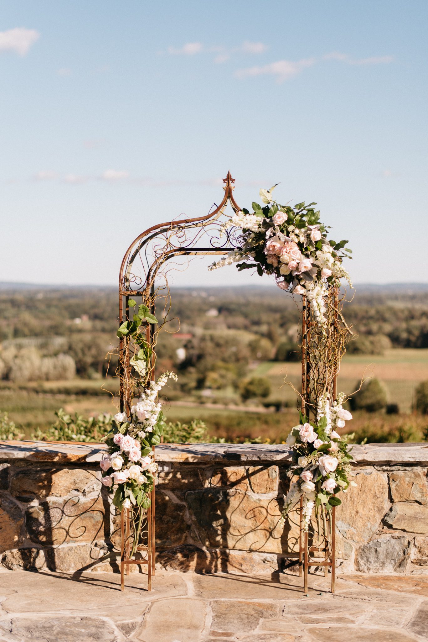 Partial arch with branches at Bluemont Vineyard. Photography by Chris Glenn.