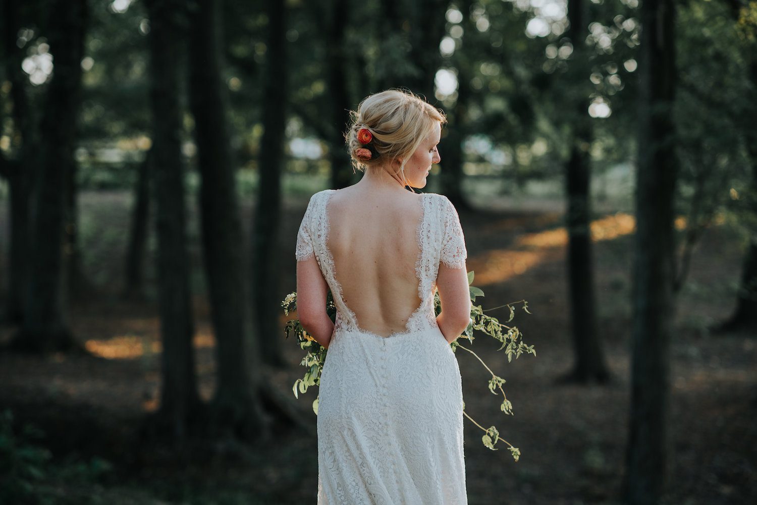 Katie Black (formerly Elliott), our lead designer and newlywed used these coral Ranunculus in her hair. She recommends Ranunculus, Spray Roses or greenery. Photography by The Purple Fern.