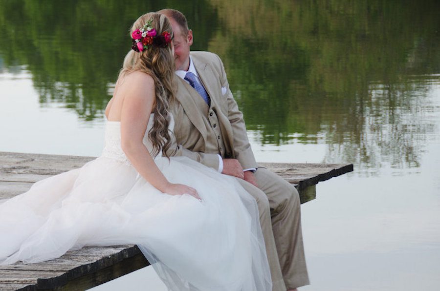 Newlywed Megan Ryan loved the fresh flowers and hair style designed by Styles by Jette.&nbsp;Photography by Sarah E Fortney.