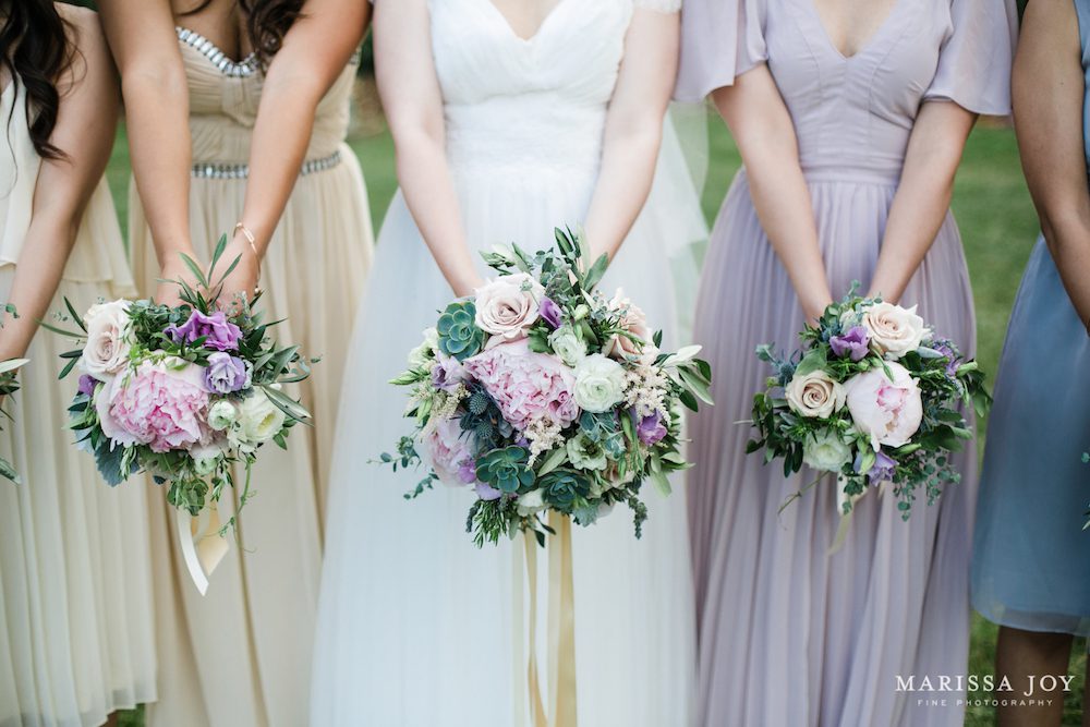 Trailing Ivory ribbons complement the gowns. Photo: Marissa Joy Photography