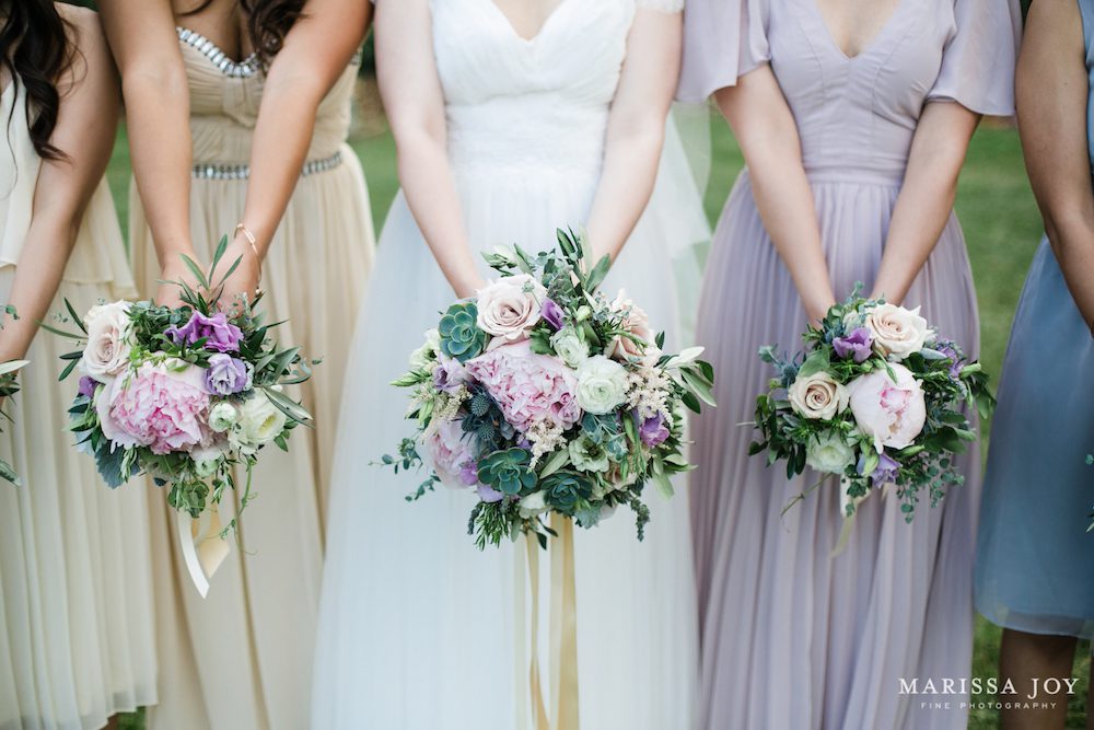 Trailing Ivory ribbons complement the gowns. Photo: Marissa Joy Photography