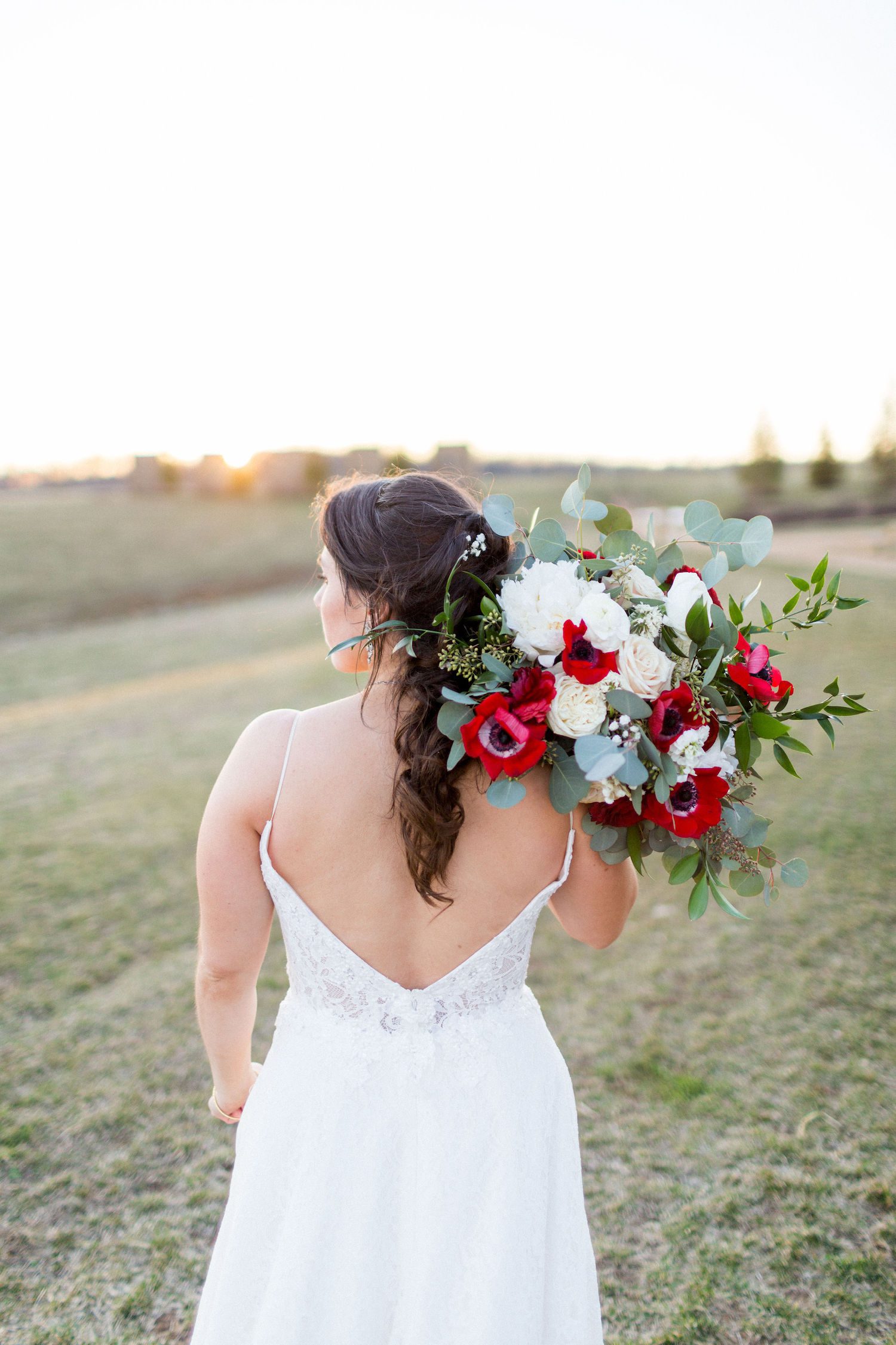 A loose bridal bouquet in white and red at Stone Tower Winery, Kir2Ben photography.