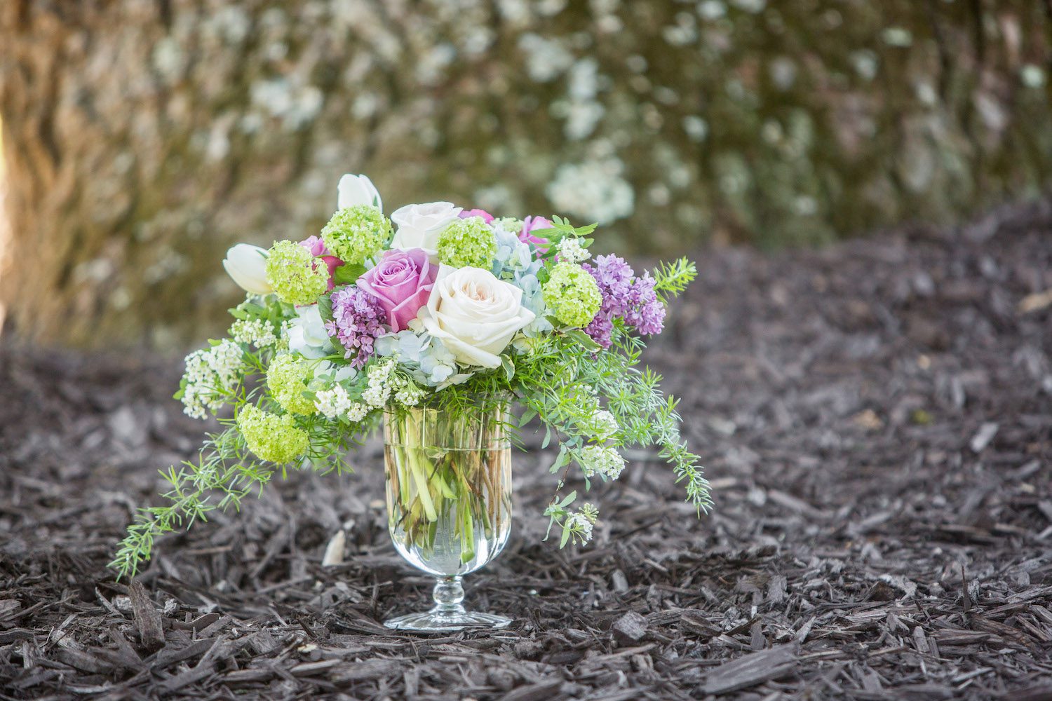 "Collette" with Viburnum, Lilac, Spirea, Tulips and Roses