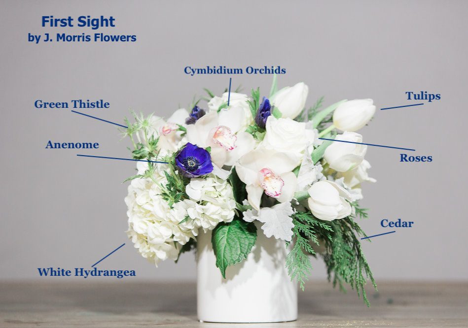 "First Sight" features Anenome and White Cymbidium Orchids.