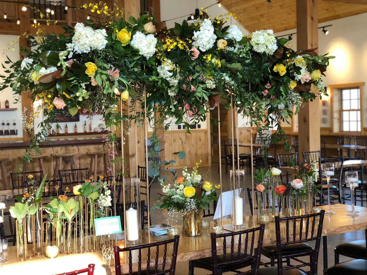 A head table installation that rises above the wedding party.