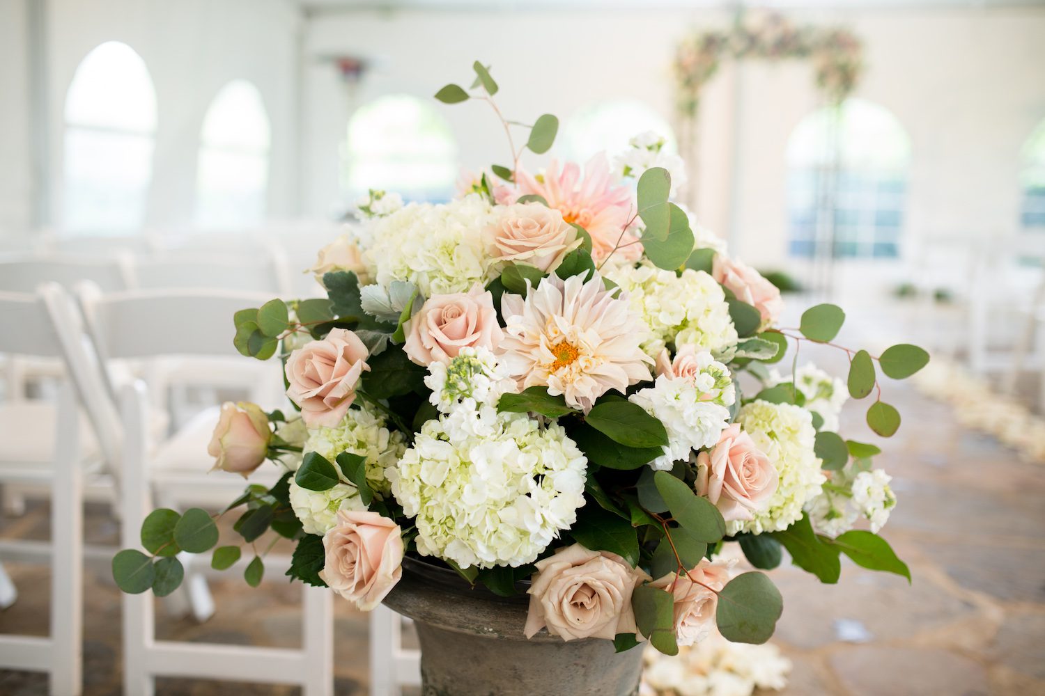 Stunning ceremony urn with Cafe Au Lait Dahlia's at Poplar Springs Inn. Photo by Lovesome Photography.