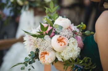 The Bridesmaids wore dark green to complement the &nbsp;flowers, Photography by Carly Romeo + Co.