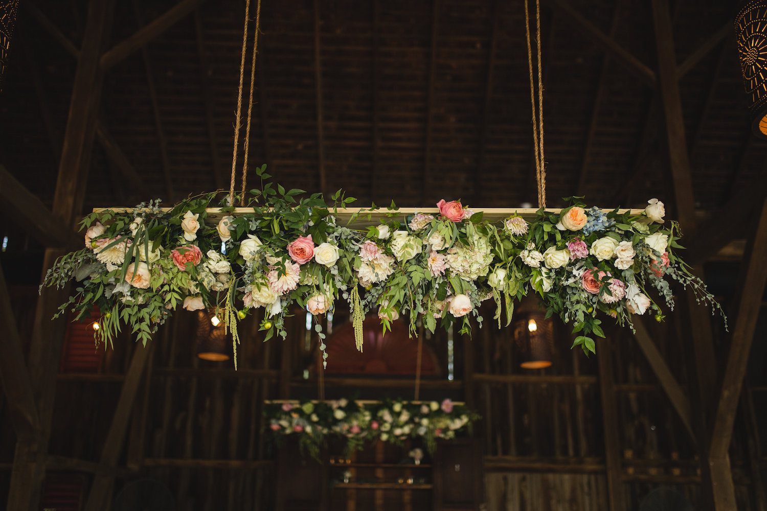 Hanging Chandelier suits the vaulted barn ceiling at Riverside On The Potomac. Photography by Carly Romeo.