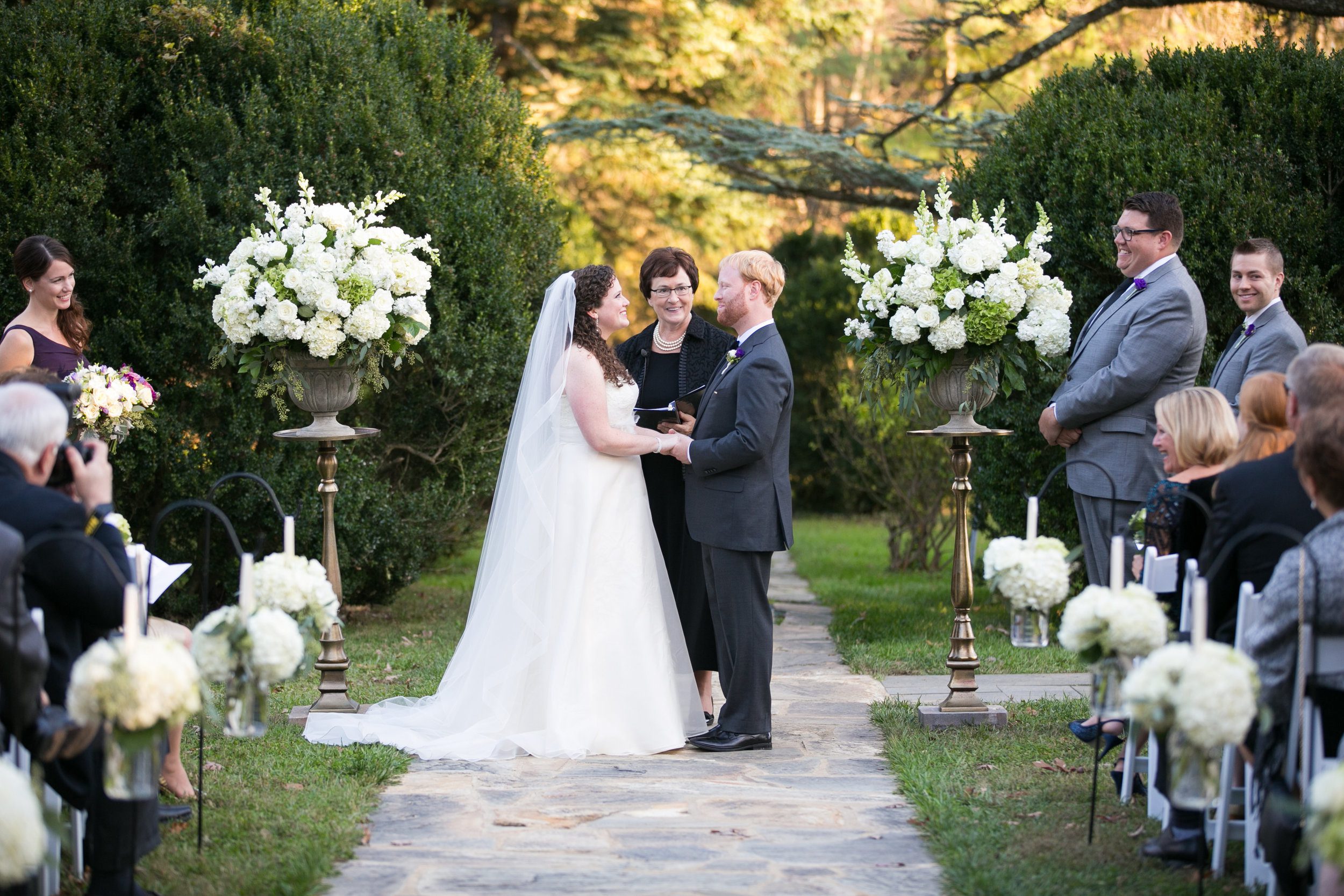 The bride wanted a very timeless look that felt like a wedding and opted not to go with traditional fall colors, but rather white and sage greens.&nbsp;