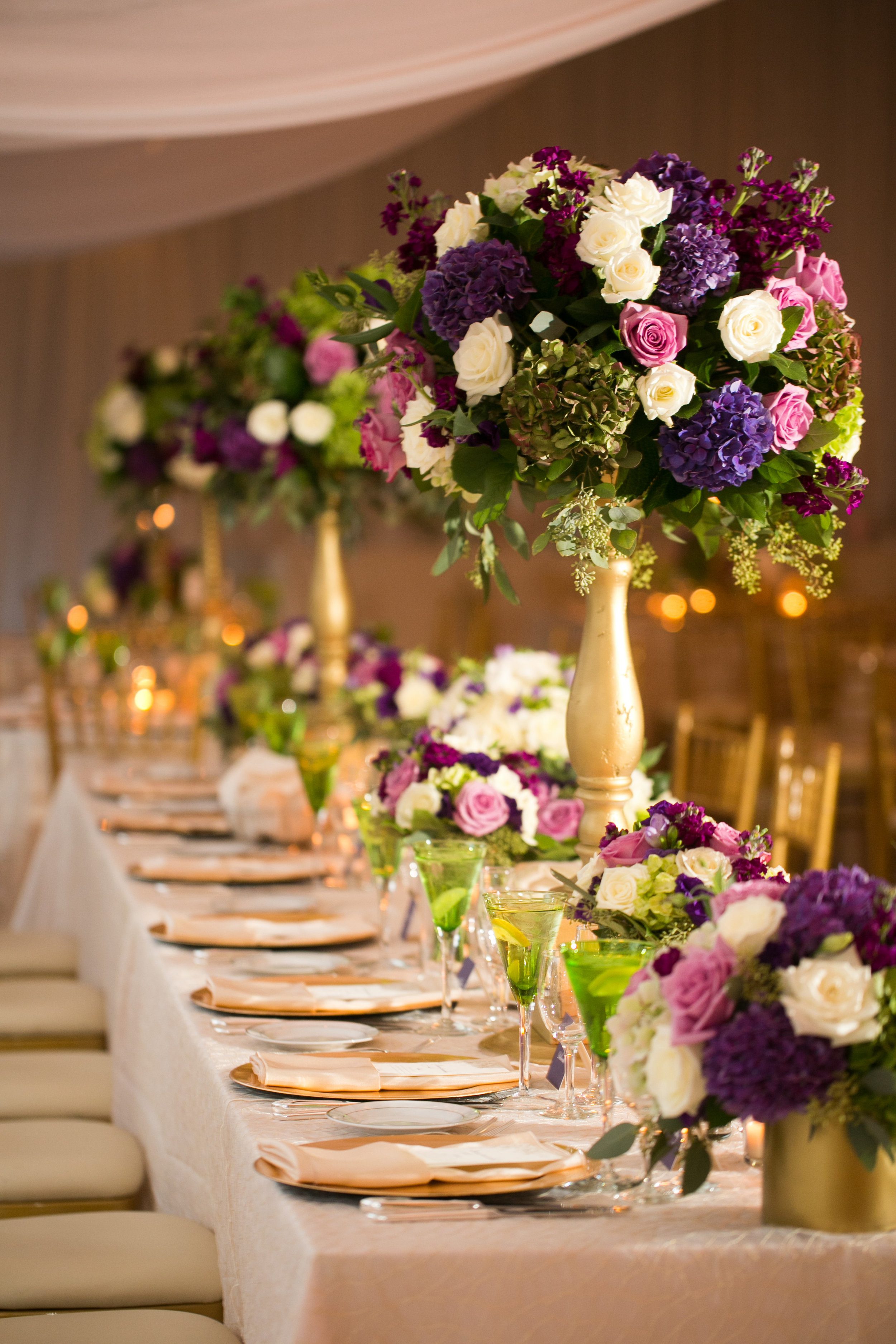 The head-table was TO-DIE-FOR! &nbsp;A mix of high and low with the bridesmaids bouquets added in to make a luxurious and flower-rich look.&nbsp;